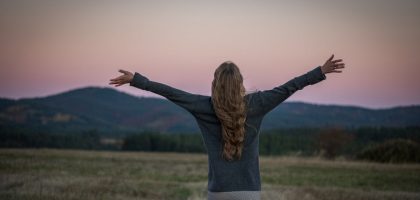 A portrait of a girl from behind just after sunset